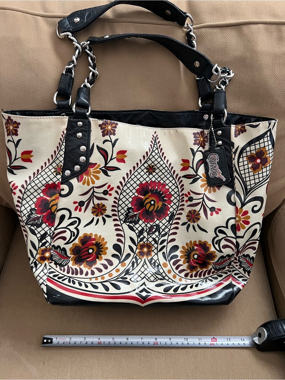Carlos Santana Cream Floral Canvas Tote with Black Trim and Red Accents.
